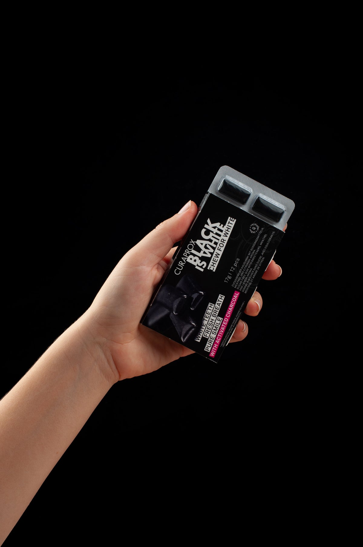 Editorial_Black is white_Curaprox World_2024_Chewing gum_Hand